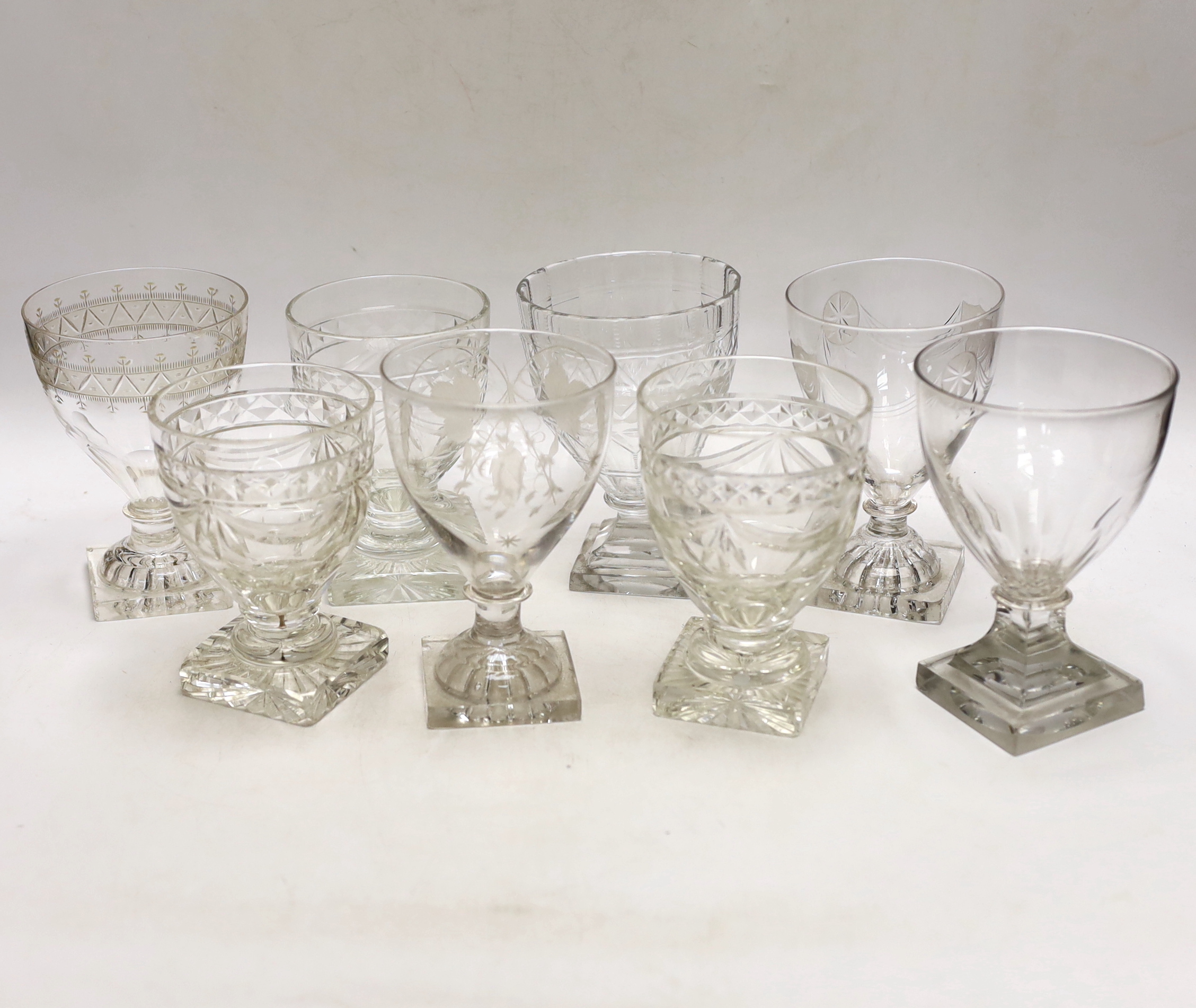 Three late 19th early 20th century square base wine glasses, three similar etched glasses and another (8)